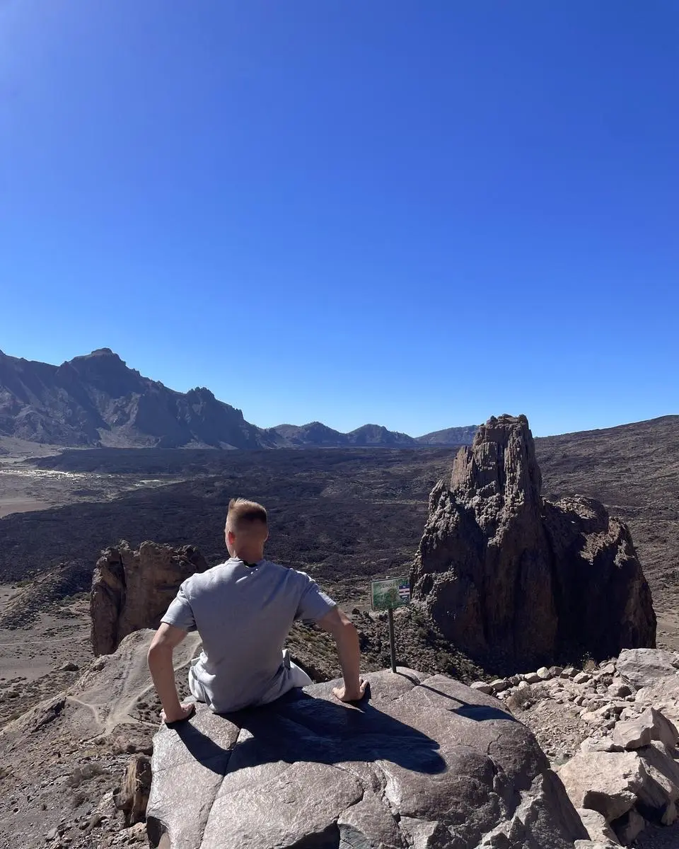 Sitting on lava rock in a volcanic caldera