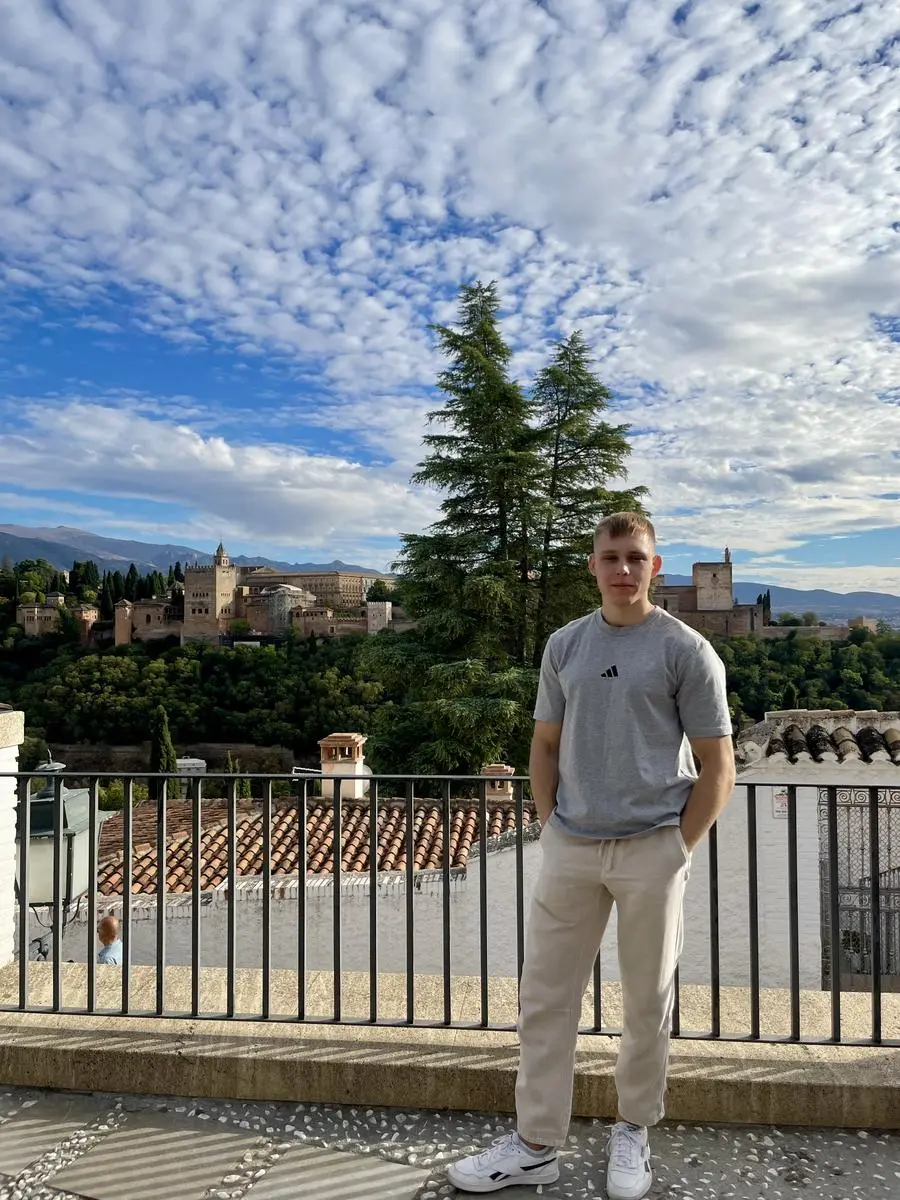 At a viewpoint facing a hilltop palace across the valley